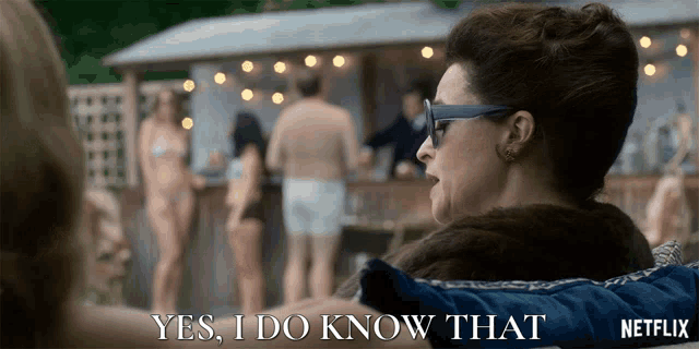 a woman says yes i do know that in front of a group of people in bikinis