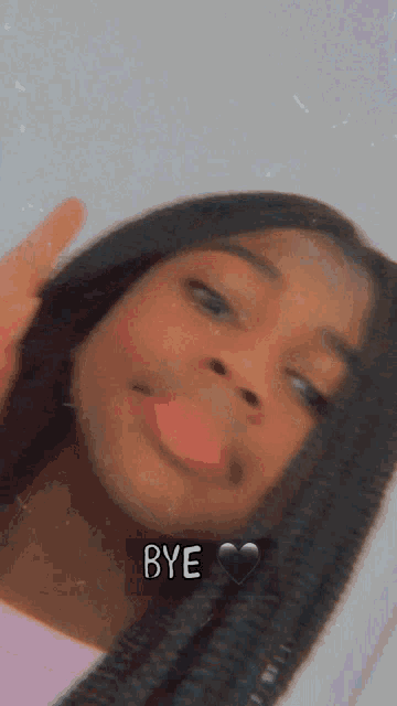 a girl is taking a selfie with the words bye written on the bottom