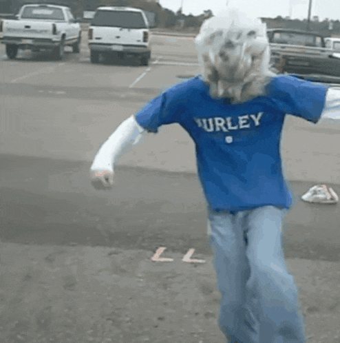 a person wearing a blue hurley shirt is dancing