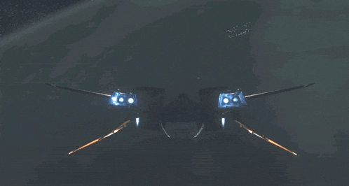 a fighter jet is flying through the night sky with its wings spread