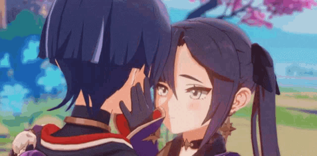 a couple of anime characters are kissing each other .