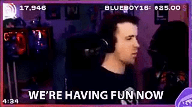 a man wearing headphones says we 're having fun now on a screen .