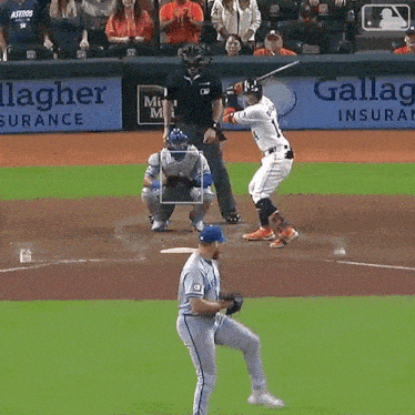 a baseball game is being played in front of a sign that says gallagher