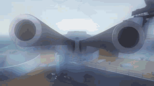 two large cannons on a ship with fog coming out of them