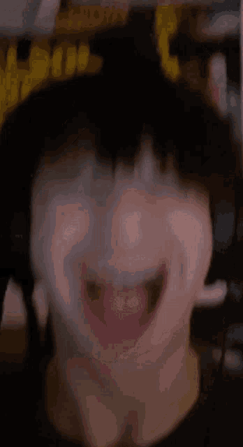 a close up of a man with his mouth open
