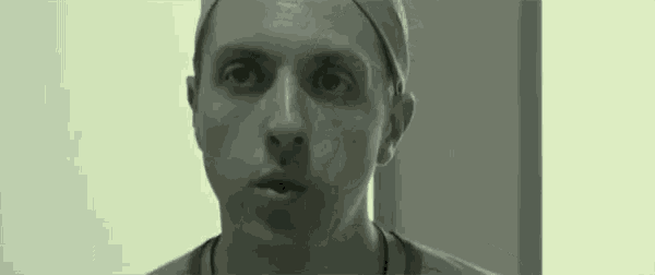 a man wearing a surgical cap is making a funny face while looking at the camera .