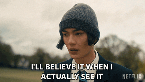 a man wearing a beanie and a suit says i 'll believe it when i actually see it
