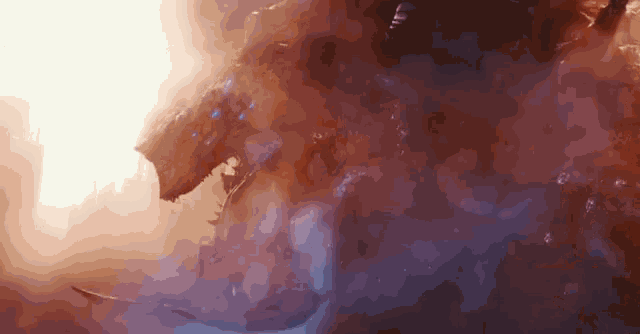 a large monster is surrounded by smoke and flames in a dark room .