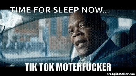 a man is driving a car with the words `` time for sleep now ... tik tok moterfucker '' written on it .