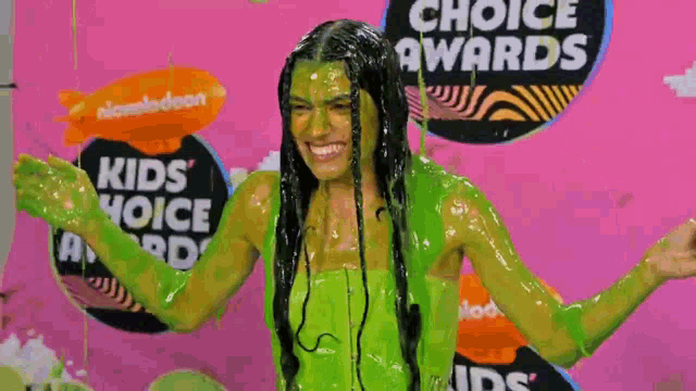 a girl is covered in green slime at the kids choice awards