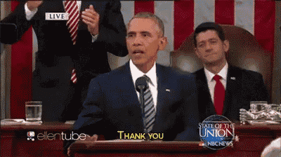 a man in a suit and tie says thank you