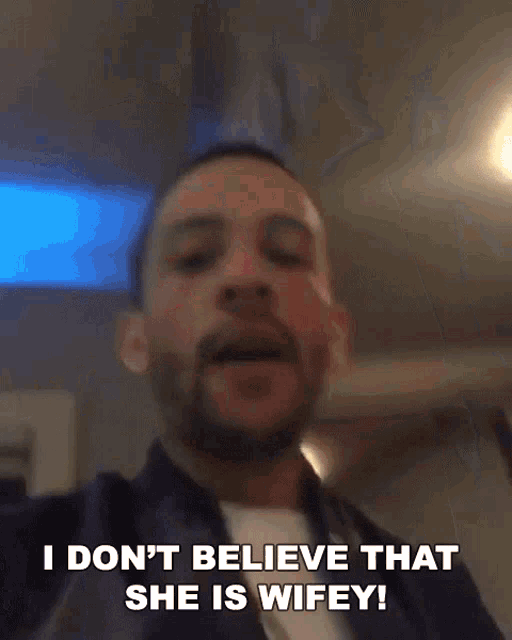 a man with a beard is saying i don 't believe that she is wifey