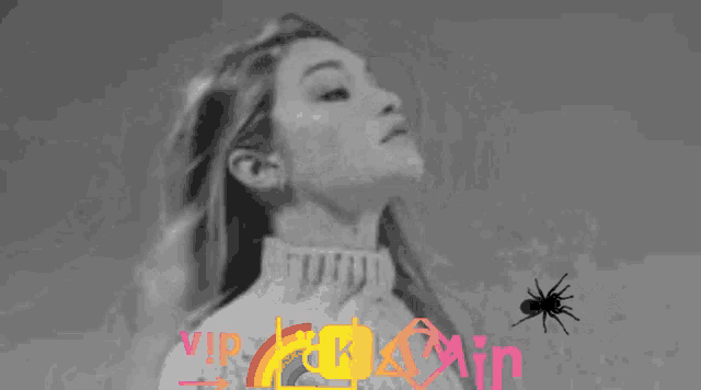 a black and white photo of a woman covering her face with a spider and the words vip fuck min
