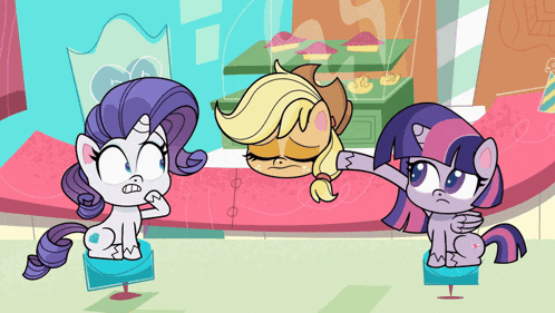 a cartoon of two ponies standing next to each other with cupcakes on a table in the background