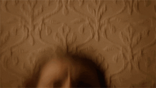 a close up of a woman 's face with her mouth wide open