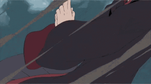 itachi uchiha from naruto is wearing a hooded cloak and holding a fireball in his mouth .