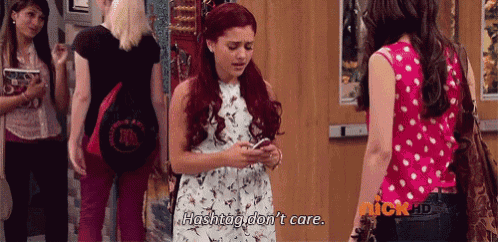 a girl with red hair says hashtag don 't care while looking at her phone