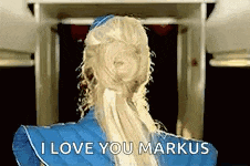 a woman with blonde hair is wearing a blue dress and says i love you markus
