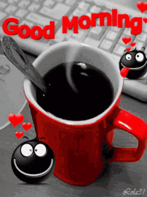 a cup of coffee with a spoon in it and the words good morning written on it