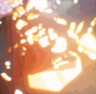 a blurred image of a person 's face with a few spots of light coming out of it