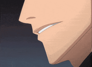 a close up of a man 's face with a white smile