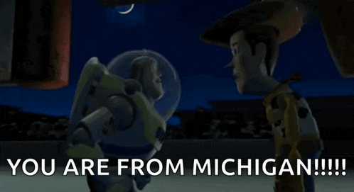 buzz lightyear and woody from toy story are standing next to each other .