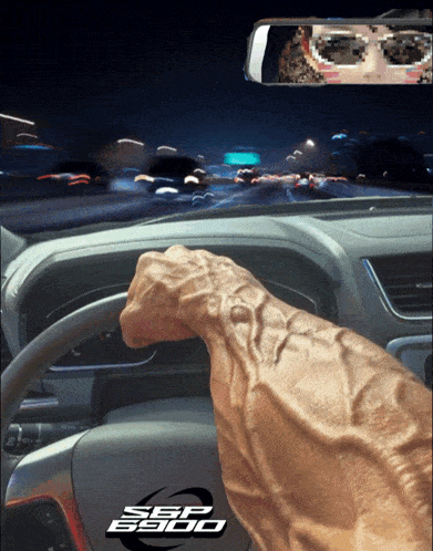 a car with a sbp sticker on the dashboard