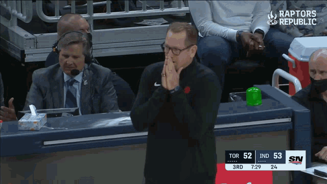 a basketball game between the raptors and the indians is being played