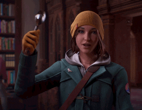a woman in a yellow hat holds a silver spoon in her hands