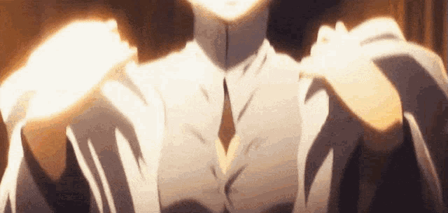 a close up of a person 's shoulder and chest with a light shining on it .