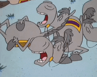 a group of cartoon characters are laying on top of each other with their mouths open .