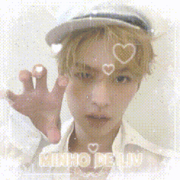 a man wearing a hat with hearts on his forehead