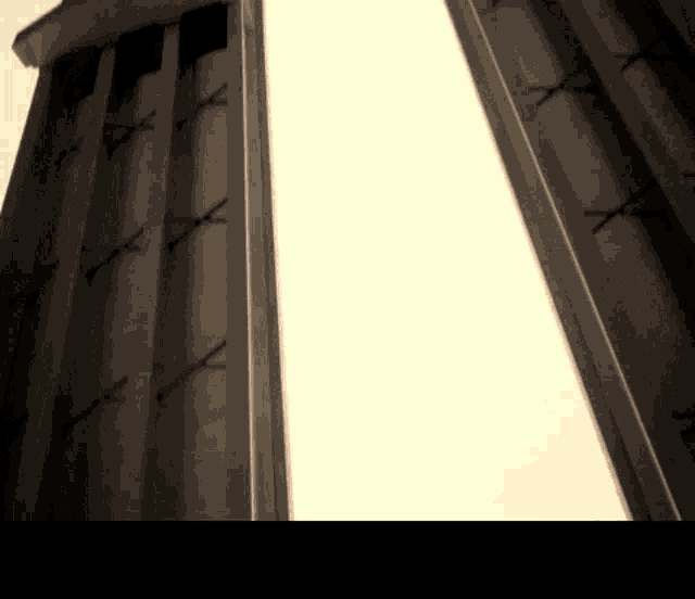 looking up at a building with a white background