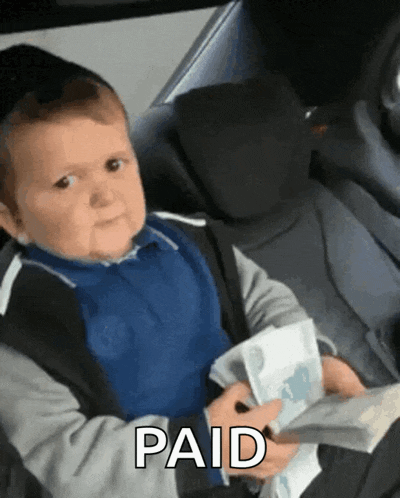 a little boy is holding a bunch of money and the word paid is on the bottom right
