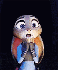 a cartoon rabbit with a surprised look on its face is holding its hands to its mouth .