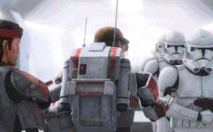 a group of stormtroopers are standing next to each other and talking to each other .