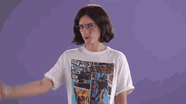 a woman wearing a white t-shirt that says sex pistols