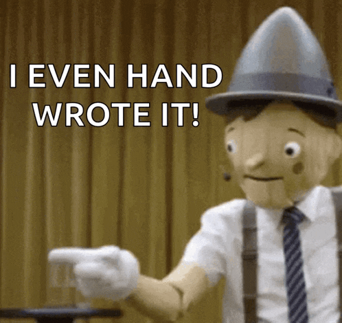 a wooden puppet pointing with the words " i even hand wrote it "