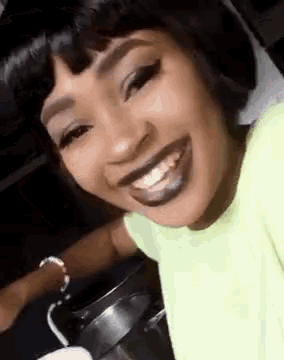 a close up of a woman 's face with a smile on her face .