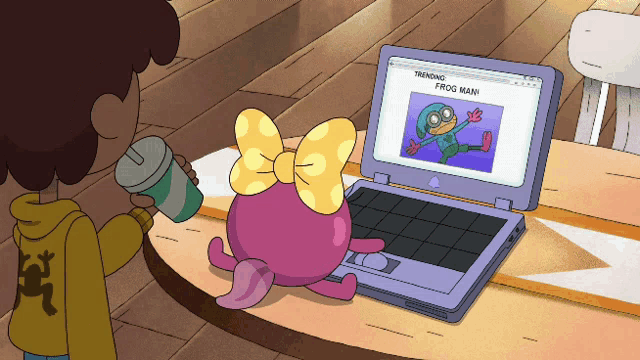 a cartoon of a girl looking at a laptop with a picture of a frog on it