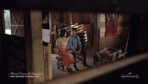 a man and a woman are looking at each other in a hallmark advertisement