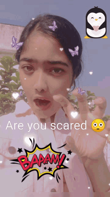 a girl with butterflies in her hair and the words " are you scared "