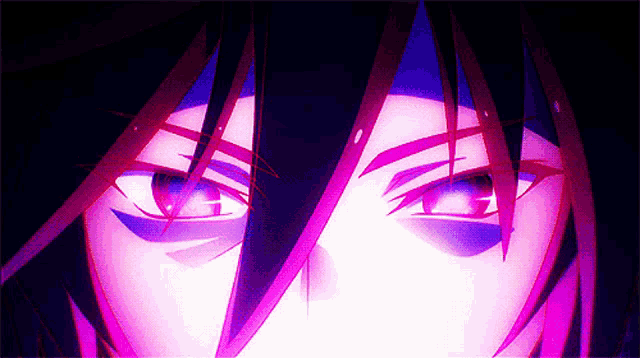 a close up of a person 's eyes with purple light coming out of them .