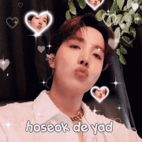 a picture of a young man with hearts around him and the words hoseok de yad