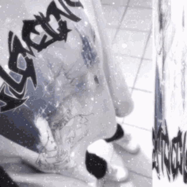 a person wearing a t-shirt that says ascent on it