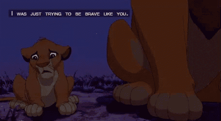 a lion cub sitting next to a lion with the words " i was just trying to be brave like you " above him