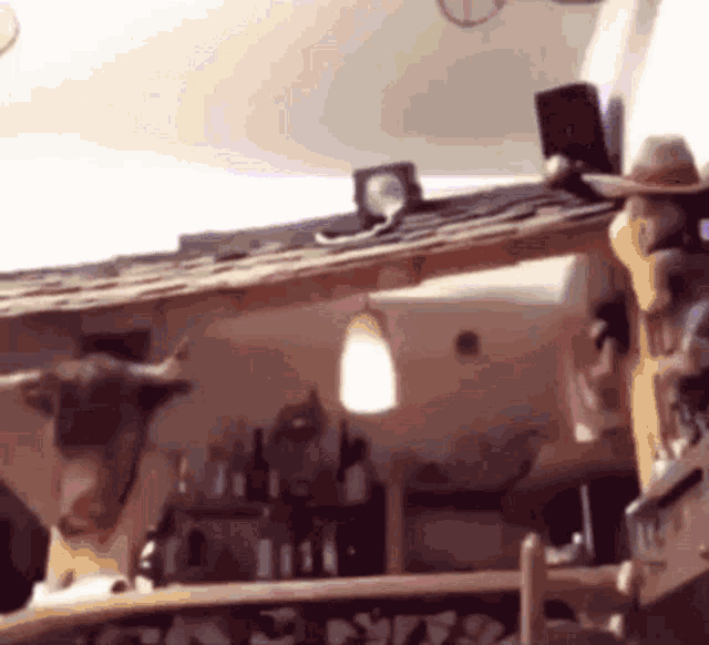 a cowboy hat is hanging from the ceiling of a building