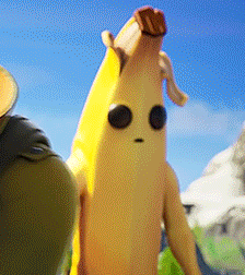 a banana with a face is standing next to a person