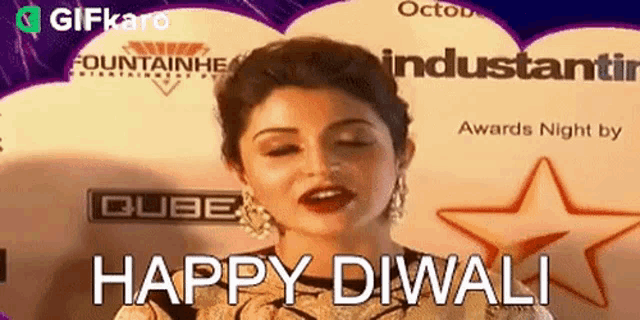 a woman with her eyes closed is saying happy diwali .