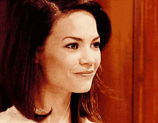 a close up of a woman with #gh written on her neck